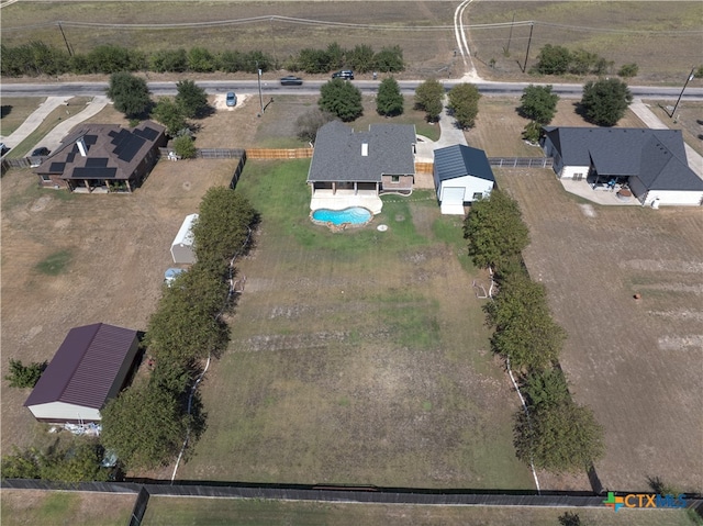 birds eye view of property with a rural view