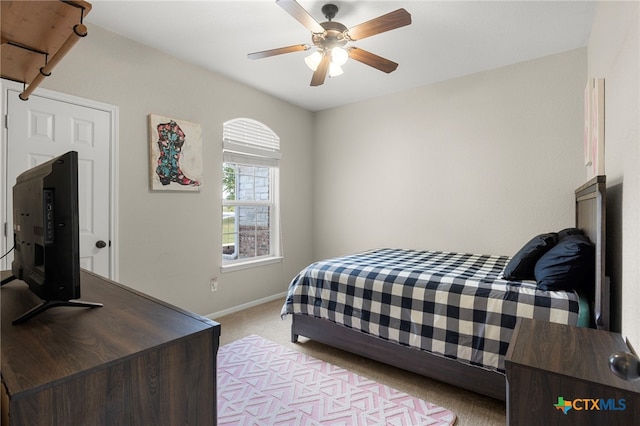 carpeted bedroom featuring ceiling fan