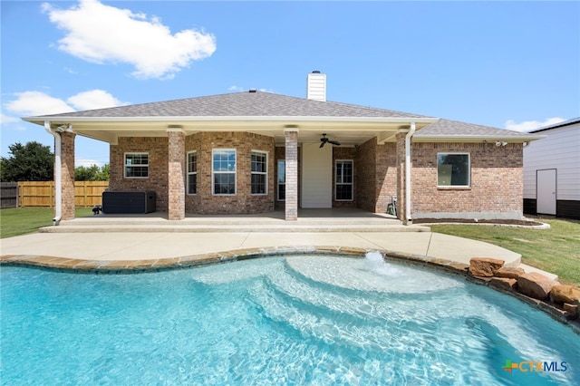 view of swimming pool featuring cooling unit, ceiling fan, and a patio area