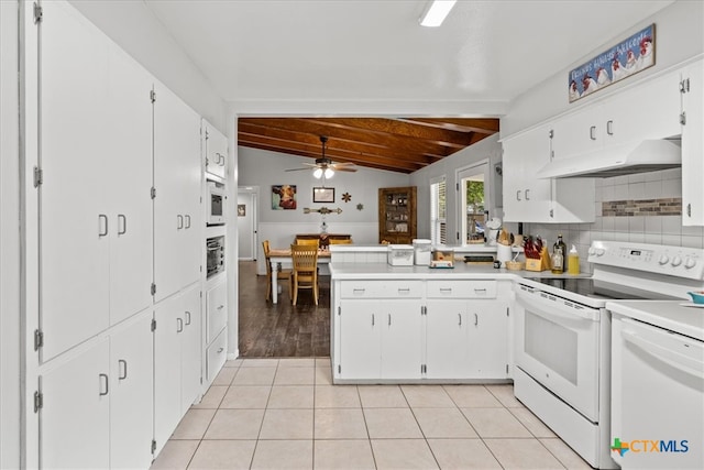 kitchen with vaulted ceiling with beams, light tile patterned floors, white cabinets, white appliances, and ceiling fan