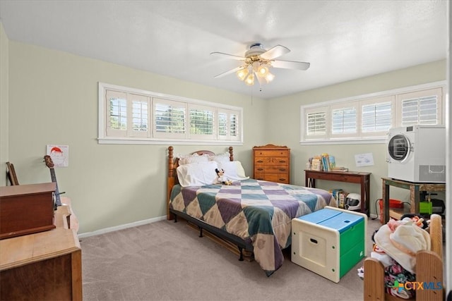 1415 Dove Ln, Seguin, TX 78155 - carpeted bedroom featuring multiple windows, baseboards, and ceiling fan