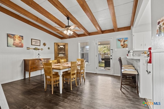 dining space with vaulted ceiling with beams, dark hardwood / wood-style floors, and ceiling fan