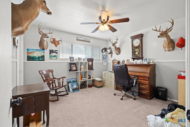 office space with light carpet and ceiling fan