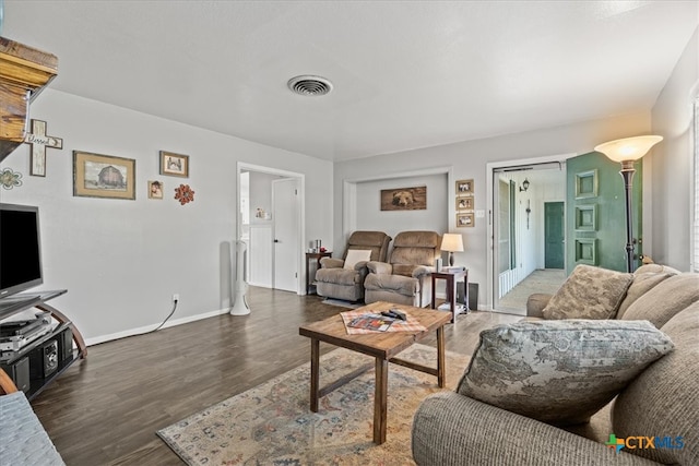 living room featuring dark hardwood / wood-style flooring