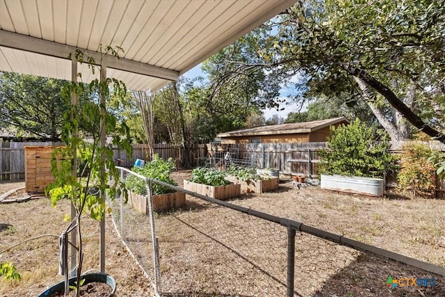 1415 Dove Ln, Seguin, TX 78155 - fenced backyard featuring a vegetable garden