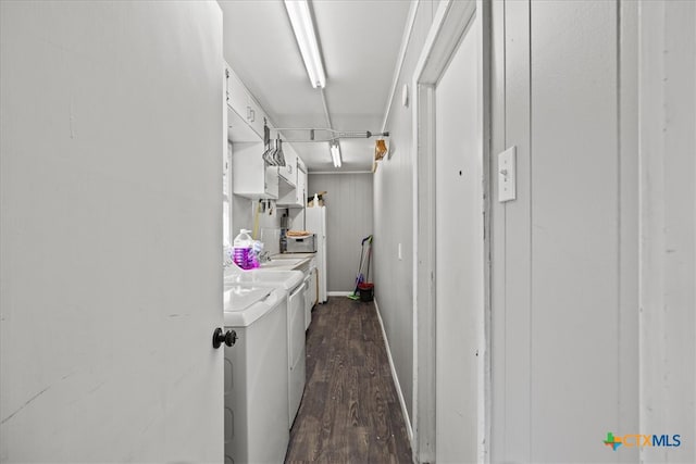 laundry area featuring dark hardwood / wood-style flooring and washing machine and clothes dryer