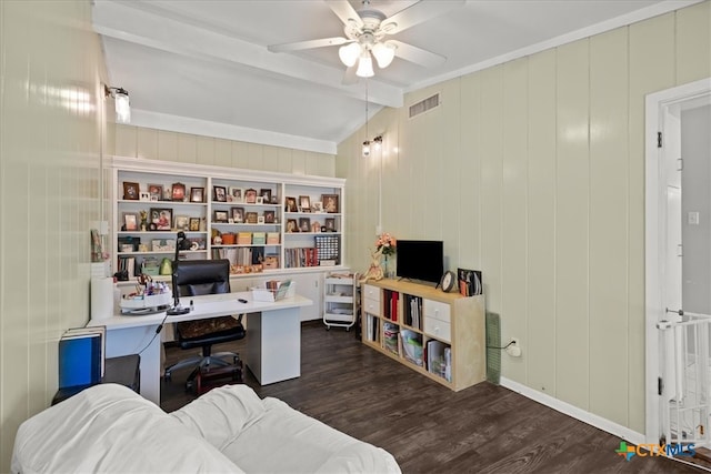 home office with dark hardwood / wood-style flooring, wood walls, vaulted ceiling with beams, and ceiling fan