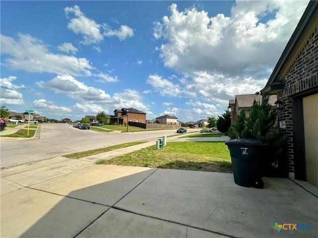 view of road featuring a residential view and sidewalks