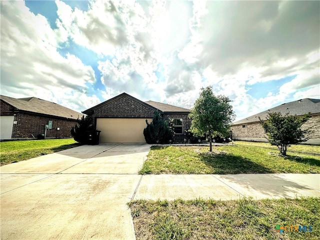 ranch-style home featuring an attached garage, a front lawn, brick siding, and concrete driveway