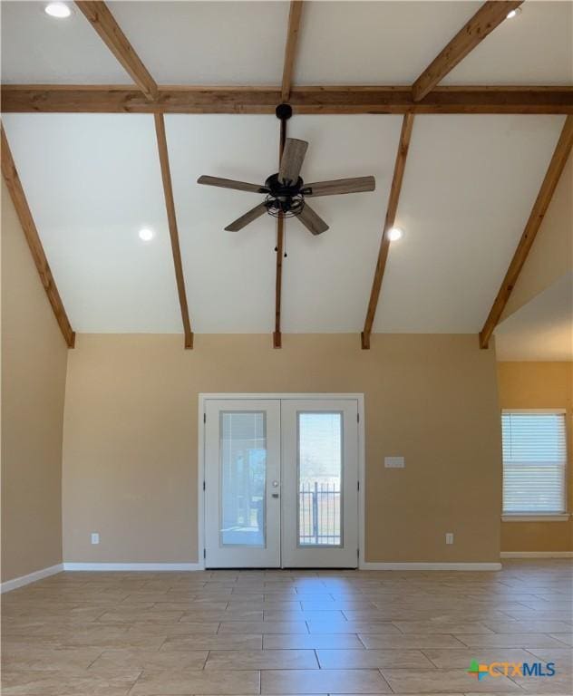 foyer featuring french doors, vaulted ceiling, and ceiling fan