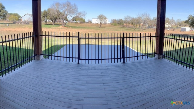 wooden deck featuring a yard