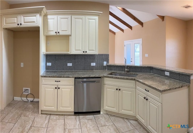 kitchen featuring sink, tasteful backsplash, vaulted ceiling with beams, stainless steel dishwasher, and dark stone countertops