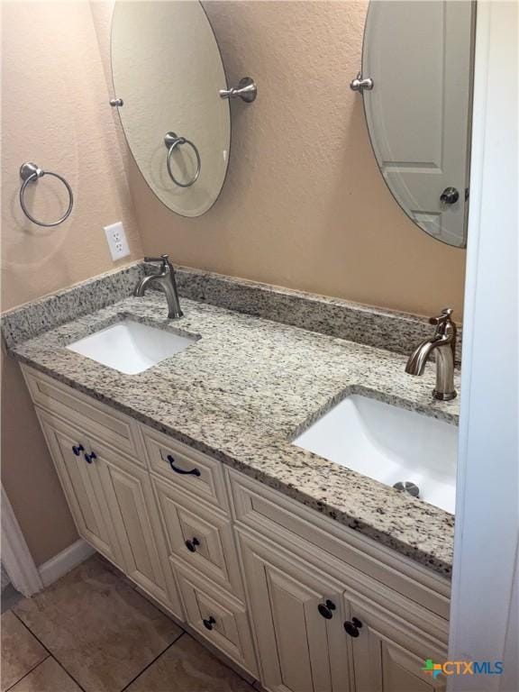 bathroom featuring tile patterned floors and vanity