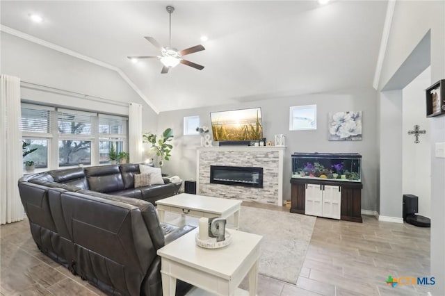 living room with crown molding, ceiling fan, and lofted ceiling