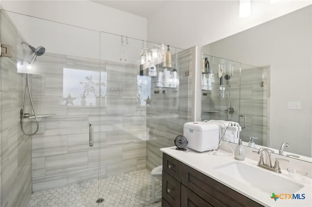 bathroom featuring vanity, an enclosed shower, and toilet