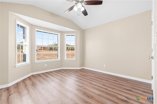 unfurnished room with ceiling fan, light hardwood / wood-style flooring, and lofted ceiling