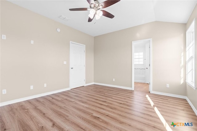 unfurnished room with light wood-type flooring, vaulted ceiling, and ceiling fan