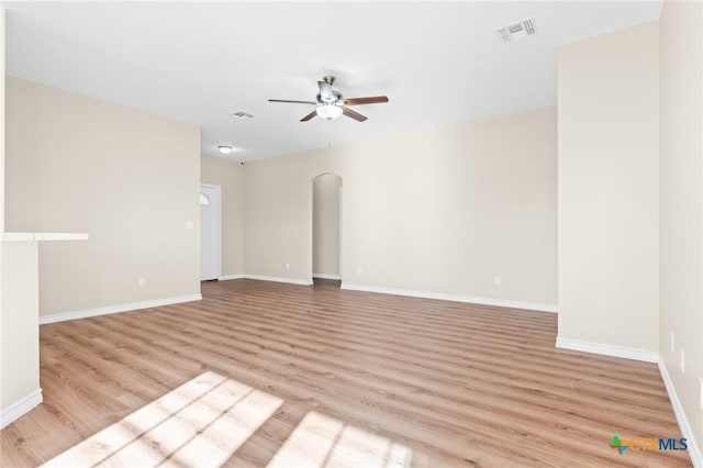 spare room featuring ceiling fan and light wood-type flooring