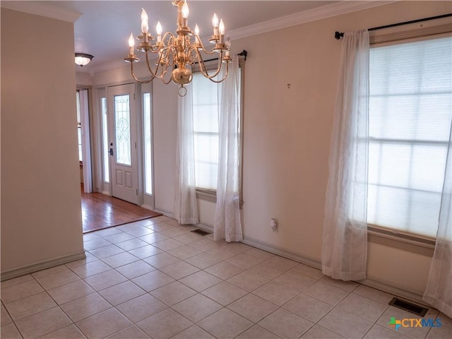 interior space with visible vents, ornamental molding, light tile patterned flooring, baseboards, and a chandelier