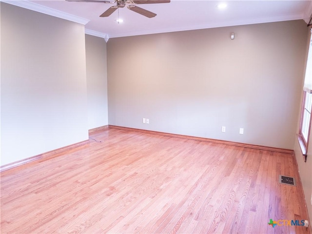 spare room featuring crown molding, ceiling fan, light wood finished floors, recessed lighting, and baseboards