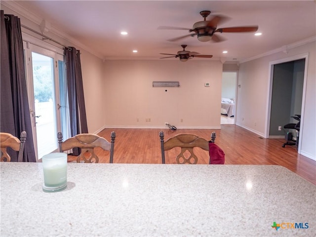 dining area with ceiling fan, ornamental molding, recessed lighting, and wood finished floors