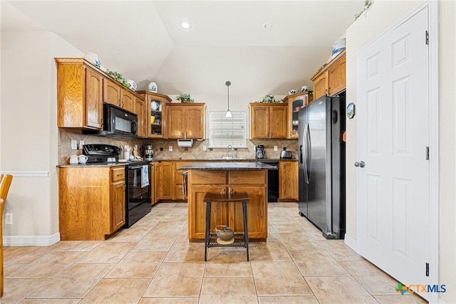 1907 Merlin Dr, Harker Heights, TX 76548 - kitchen with black appliances, backsplash, brown cabinets, a kitchen island, and lofted ceiling