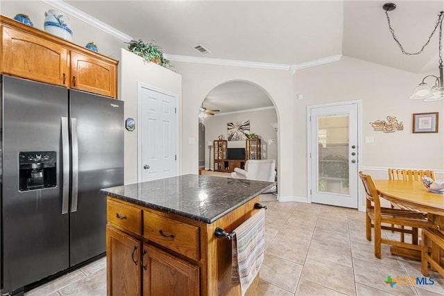 1907 Merlin Dr, Harker Heights, TX 76548 - kitchen featuring stainless steel refrigerator with ice dispenser, a kitchen island, brown cabinets, arched walkways, and crown molding