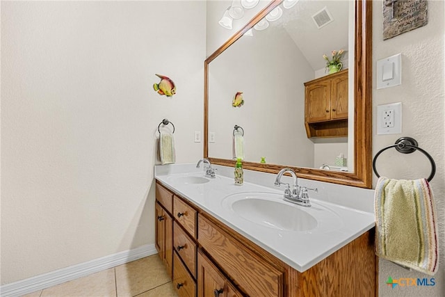 1907 Merlin Dr, Harker Heights, TX 76548 - bathroom with double vanity, tile patterned floors, and baseboards
