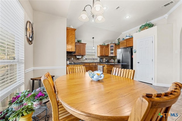 1907 Merlin Dr, Harker Heights, TX 76548 - dining area with a chandelier, lofted ceiling, ornamental molding, and baseboards