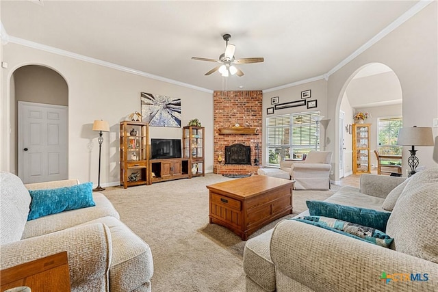 1907 Merlin Dr, Harker Heights, TX 76548 - living area featuring light carpet, ceiling fan, arched walkways, crown molding, and a fireplace