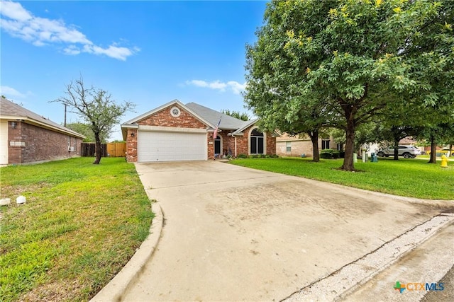 1907 Merlin Dr, Harker Heights, TX 76548 - view of front of house with an attached garage, concrete driveway, and brick siding