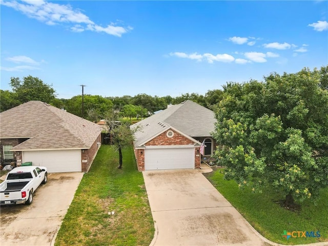 1907 Merlin Dr, Harker Heights, TX 76548 - view of front of home with brick siding, a front yard, and concrete driveway