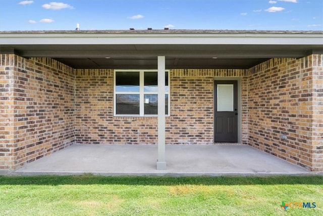 property entrance featuring a patio