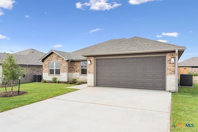 ranch-style home with a front lawn, central AC unit, and a garage