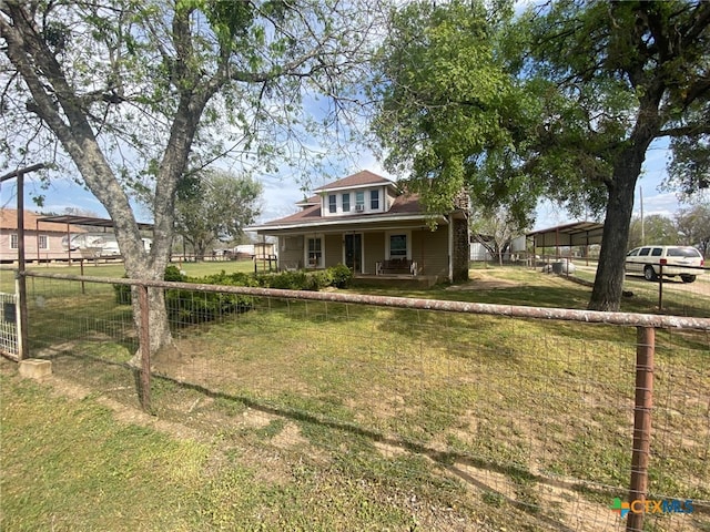view of front facade featuring fence, a porch, and a front yard