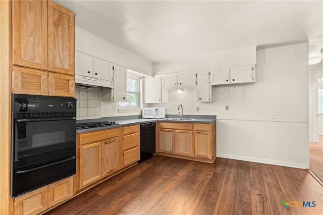 809 S 13th St, Copperas Cove, TX 76522 - kitchen with black appliances, a warming drawer, dark wood-style flooring, a sink, and white cabinetry