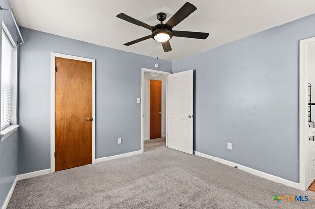 809 S 13th St, Copperas Cove, TX 76522 - unfurnished bedroom with carpet flooring, baseboards, and ceiling fan
