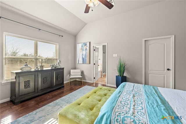 bedroom featuring dark hardwood / wood-style flooring, vaulted ceiling, and ceiling fan