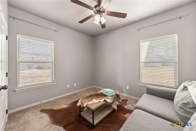 sitting room featuring carpet flooring and ceiling fan