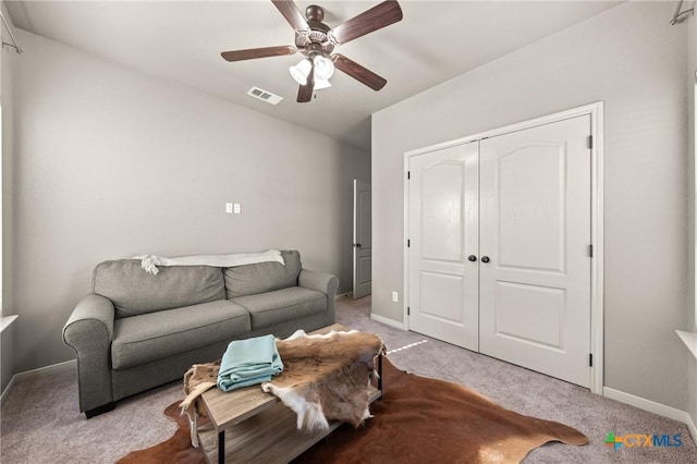 living room with ceiling fan and light carpet