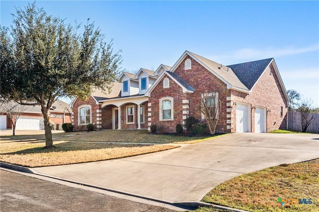 front of property featuring a garage and a front lawn