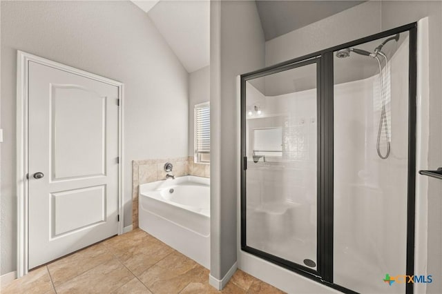 bathroom featuring vaulted ceiling, tile patterned floors, and independent shower and bath