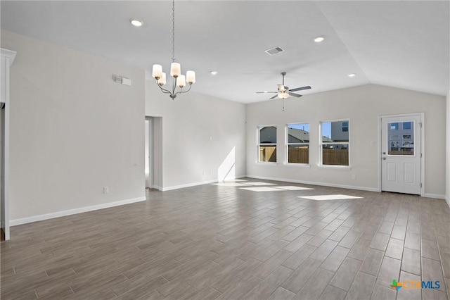 unfurnished living room with vaulted ceiling and ceiling fan with notable chandelier