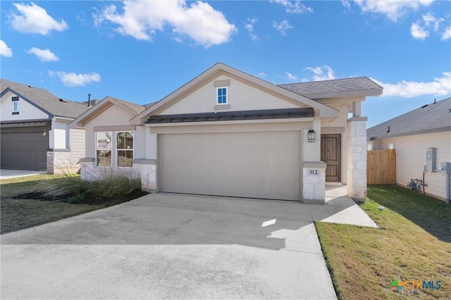 view of front of property with a garage and a front lawn