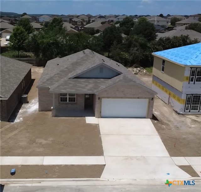1348 Lindsey Dr, Copperas Cove, TX 76522 - view of front of home featuring concrete driveway, a garage, and a residential view