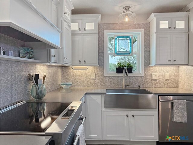 2237 Apache Dr, Harker Heights, TX 76548 - kitchen with stainless steel dishwasher, a sink, electric range, and white cabinets
