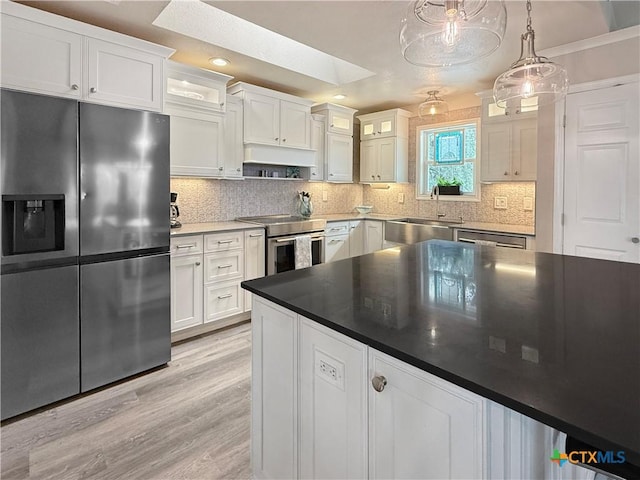 2237 Apache Dr, Harker Heights, TX 76548 - kitchen featuring stainless steel appliances, a sink, white cabinetry, light wood-type flooring, and recessed lighting