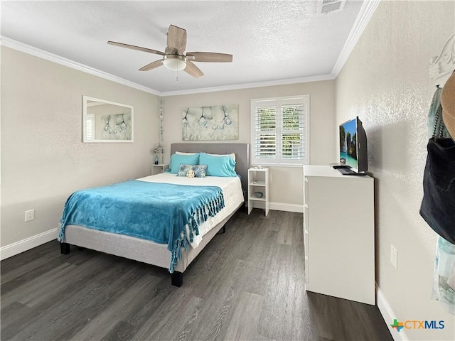 2237 Apache Dr, Harker Heights, TX 76548 - bedroom with dark wood-style flooring, ornamental molding, baseboards, ceiling fan, and a textured ceiling