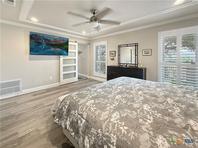 2237 Apache Dr, Harker Heights, TX 76548 - bedroom featuring a raised ceiling, wood finished floors, ornamental molding, baseboards, and recessed lighting