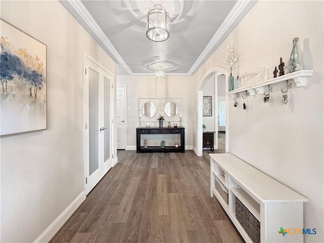 2237 Apache Dr, Harker Heights, TX 76548 - hallway with arched walkways, wood finished floors, a chandelier, crown molding, and baseboards